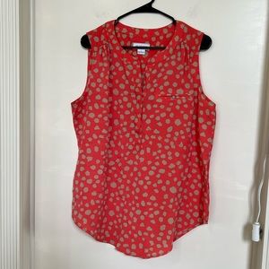 Orange and cream patterned sleeveless blouse